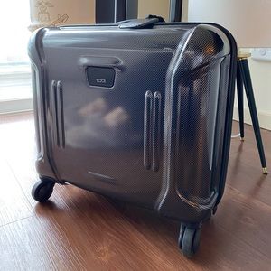 TUMI Compact carry on wheeled brief .